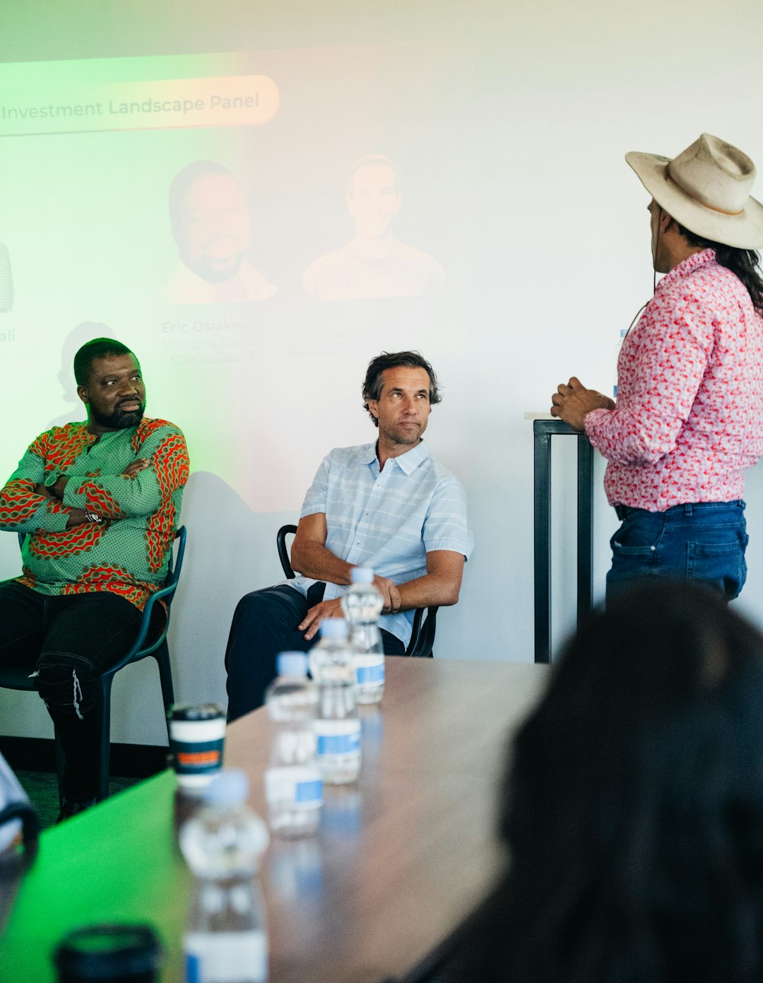 panel-discussion-with-diverse-speakers-in-a-modern-room-roiihqh2itm